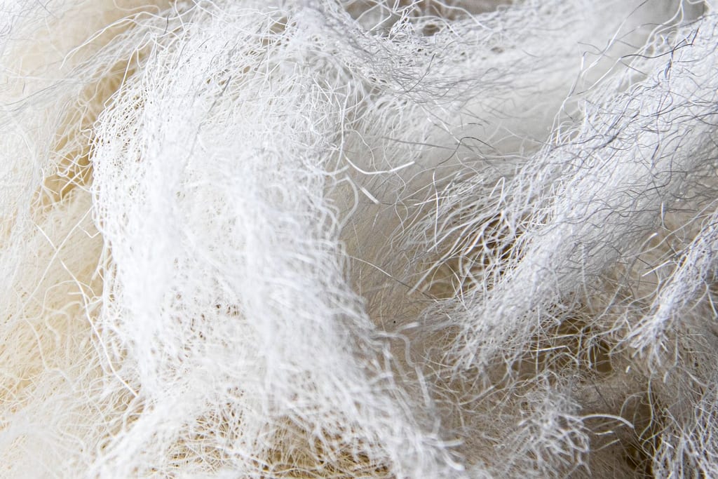 Real macro photograph of white textile fibres