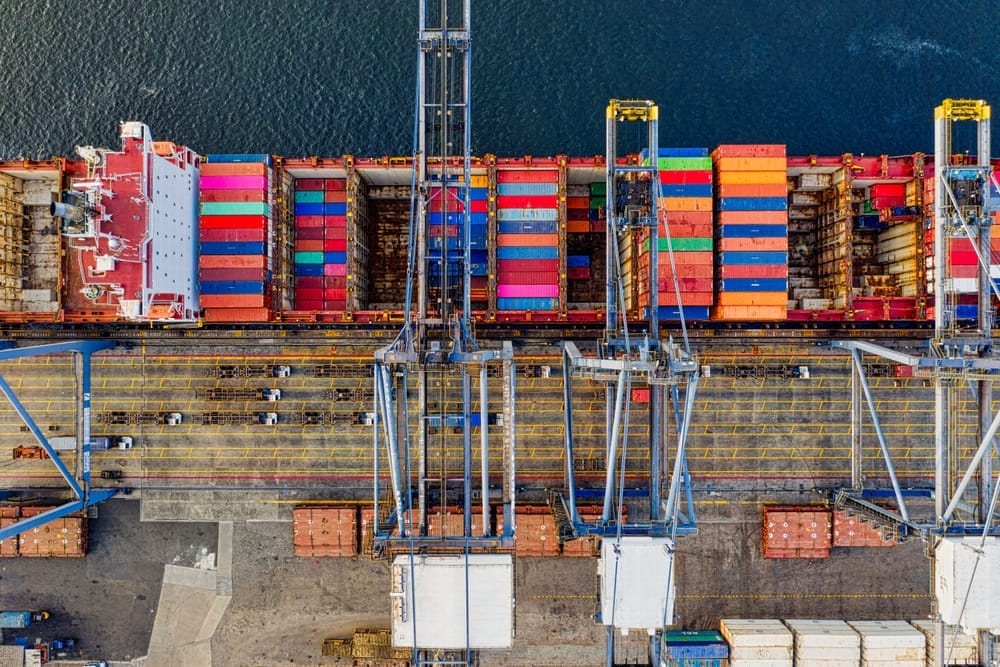 Aerial photograph of a container ship being loaded at port